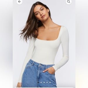 Brand new, never worn! White body suit. I accidentally ordered two of them.